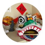 Dragon decorations and banners decorate Teacher Peng's home.