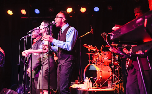 Members of the Soul Tight Committee perform onstage